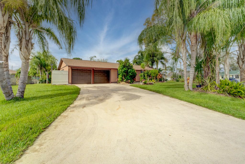 Photo of 2392 SW Madrid Road, Port Saint Lucie, FL 34953 (MLS # R10955792)