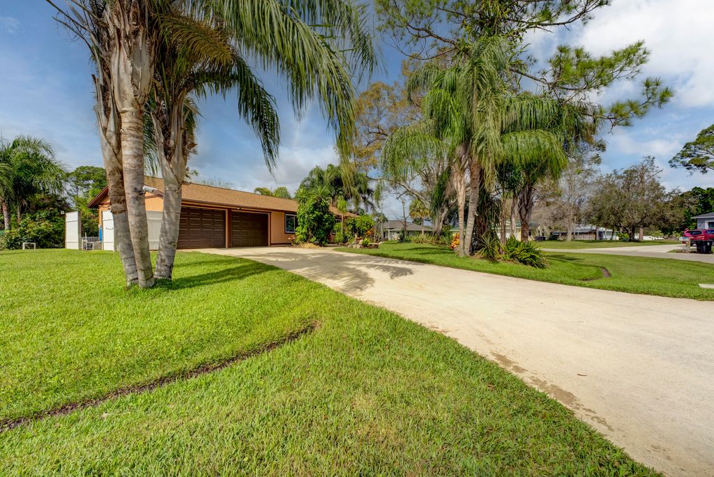 Photo of 2392 SW Madrid Road, Port Saint Lucie, FL 34953 (MLS # R10955792)