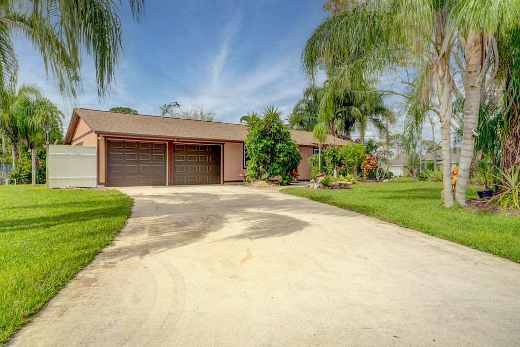 Photo of 2392 SW Madrid Road, Port Saint Lucie, FL 34953 (MLS # R10955792)