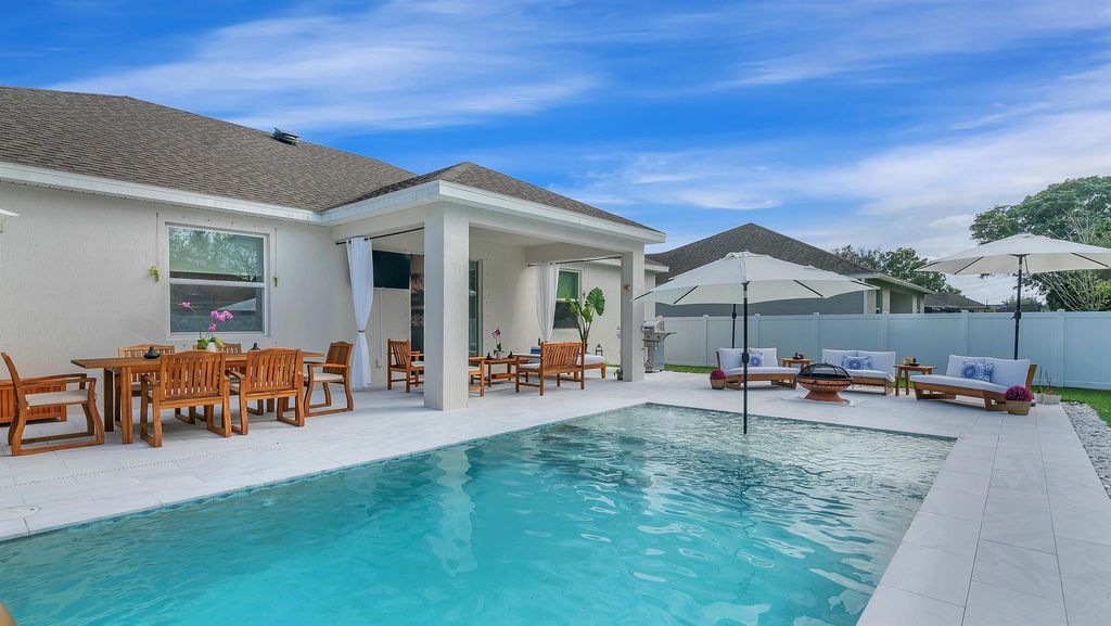 Photo of 1926 SW Ember Street, Port Saint Lucie, FL 34953 (MLS # R10950345)