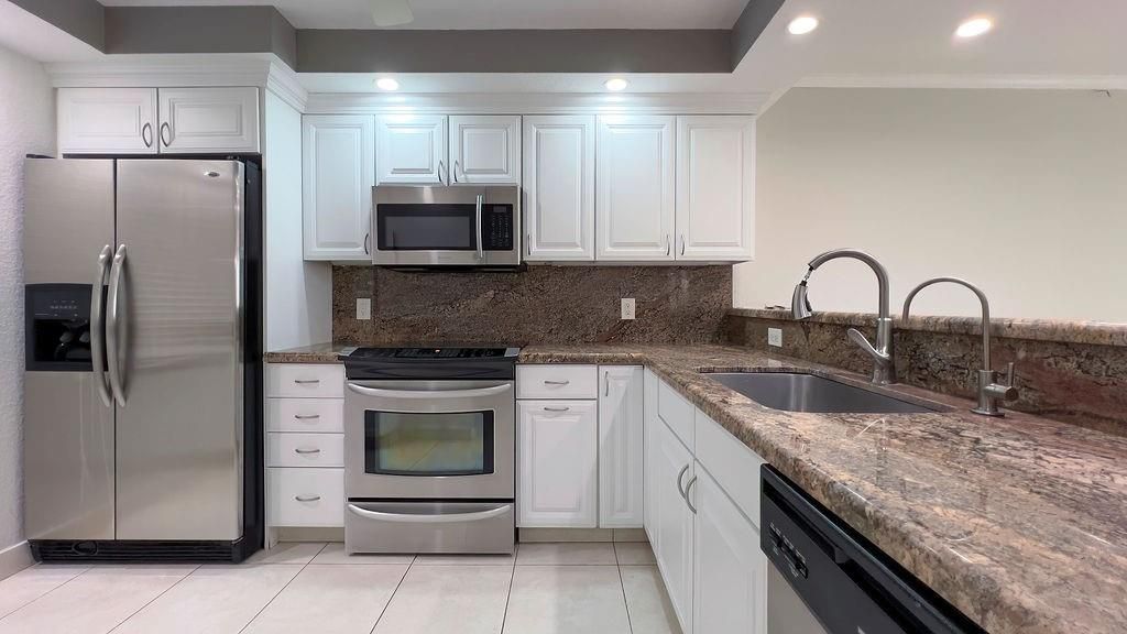Photo of 3800 Oaks Clubhouse Drive #201, Pompano Beach, FL 33069 (MLS # F10397746)