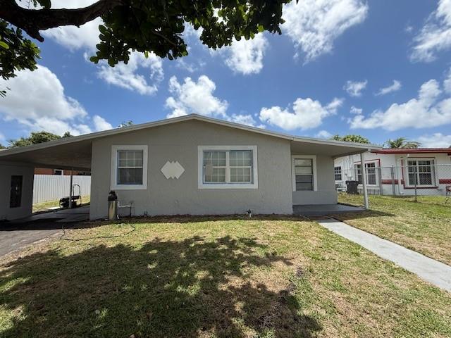 This freshly painted 3-bedroom, 1-bathroom home is move-in ready and located on a quiet street. It features a spacious layout with central AC, quartz countertops, stainless steel appliances, and a dedicated laundry room. Outside, you'll find a fenced-in backyard with fruit trees, a covered patio, a covered carport, and a nicely sized driveway. The home offers both comfort and functionality with rapid approval available. Just bring first, last, and security—and the house is yours. Available now, so call today to schedule a showing!