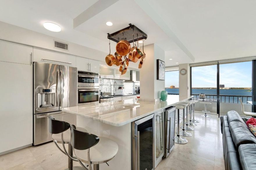 57 FOOT WRAP AROUND BALCONY WITH UNOBSTRUCTED VIEWS OF THE BLUE ATLANTIC OCEAN,INTRA COASTAL WATERWAYS AND JOHN MACARTHUR BEACH STATE PARK. ALL TILE FLOORS 
THE ENTIRE UNIT HAS BEEN TOTALLY UPGRADED OPEN KITCHEN,2 NEW BATHROOMS,WALL TO WALL AND FLOOR TO CEILING IMPACT WINDOWS THROUGH OUT THE UNIT. WASHER AND DRYER IN UNIT, 2 WINE COOLERS, 2 HEATED POOLS,NEW CLUBHOUSE ,PUTTING GREEN,4 TENNIS COURTS, SHUFFLE BOARD, BBQ PAVILION,24 HOUR SECURITY GATE, AND MOST IMPORTANT 1200 FEET OF SANDY BEACH AT YOUR FOOTSTEPS.