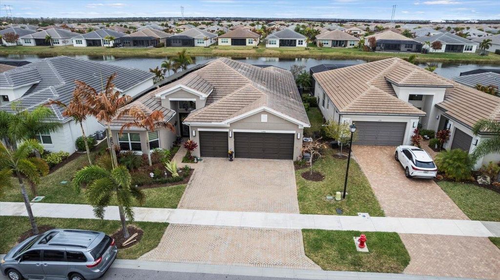 Photo of 11998 SW Laguna Bay Parkway, Port Saint Lucie, FL 34987 (MLS # R11166275)