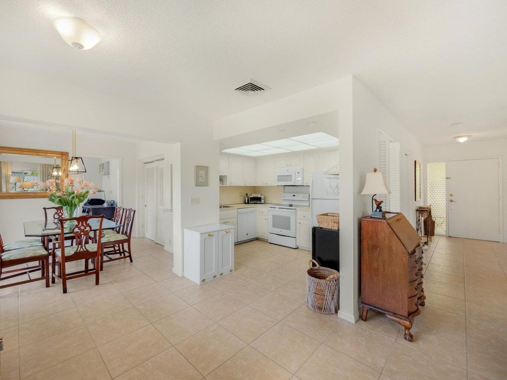 Photo of 115 Villa Circle, Atlantis, FL 33462 (MLS # R11014892)