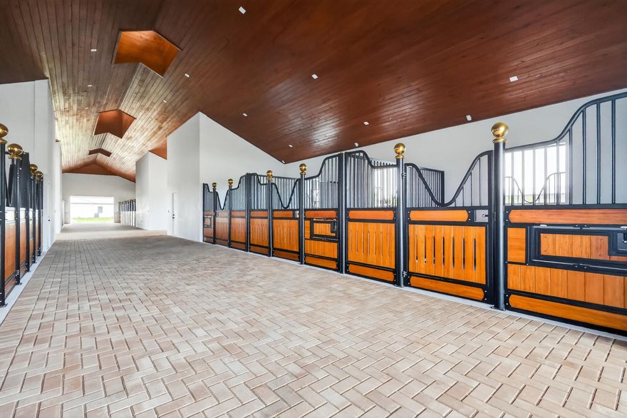 Exceptional new construction equestrian estate  The property features single-family home and a fully equipped horse facility with 12 stalls, rider's lounge with guest room, 1.5 baths, office, laundry, tack room, and a covered arena with lighting and training mirror.The main residence offers 4 bedrooms, a den/office, and an open-concept design. The gourmet kitchen boasts Taj Mahal quartz countertops, Thermador appliances, induction cooktop, custom-panel refrigerator, and custom pantry.  custom closets, ceramic tile, impact windows and doors, and a whole-house reverse osmosis system.Outside, enjoy a pool and spa, outdoor kitchen with BBQ and wine cooler, paver walkways, and a fully fenced property with gated entrance, combining luxury living with an exceptional equestrian lifestyle. WHITE FENCES EQUESTRIAN ESTATES  GATE code is 5698. Seller will pay 6 months of HOA after purchase.