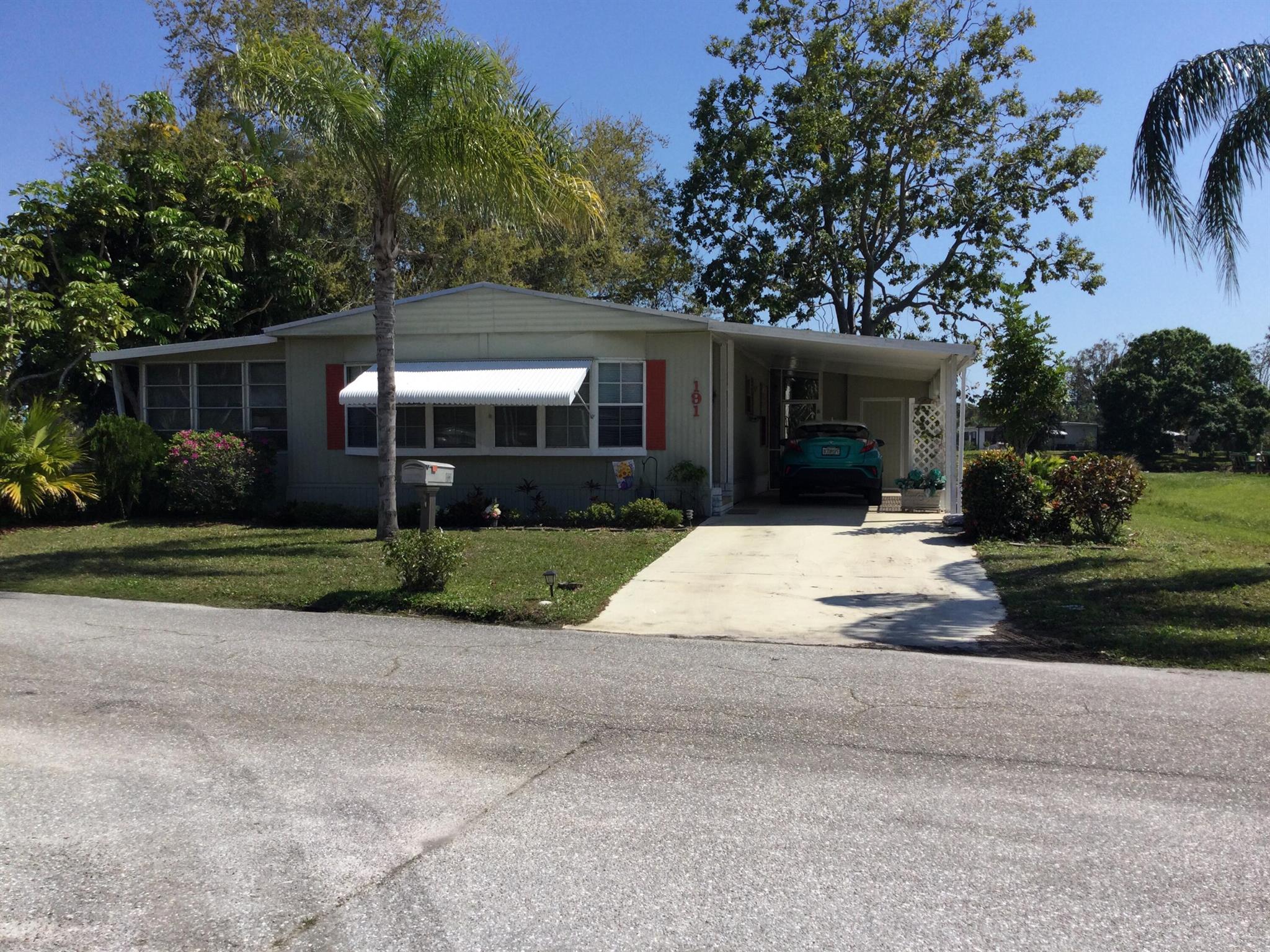 2025 metal roof on this well maintained home in the favorably sought after Spanish Lakes Golf Village.  This 2 bedroom/2 bath home is move in ready.  Land lease covers taxes, all amenities, lawn care and trash removal.  Amenities include golf, pool, pickleball, tennis, bocce, billiards, party room, clubhouse, library and much much more.  Do as much as you like or just sit by the pool and relax.  Future residents must be approved by Spanish Lakes,  Call for application.