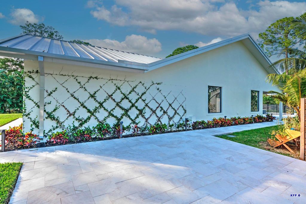 Photo of 13377 76th Road N, West Palm Beach, FL 33412 (MLS # R10938176)