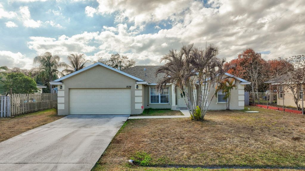 Photo of 1534 SW Hutchins Street, Port Saint Lucie, FL 34983 (MLS # R11164308)