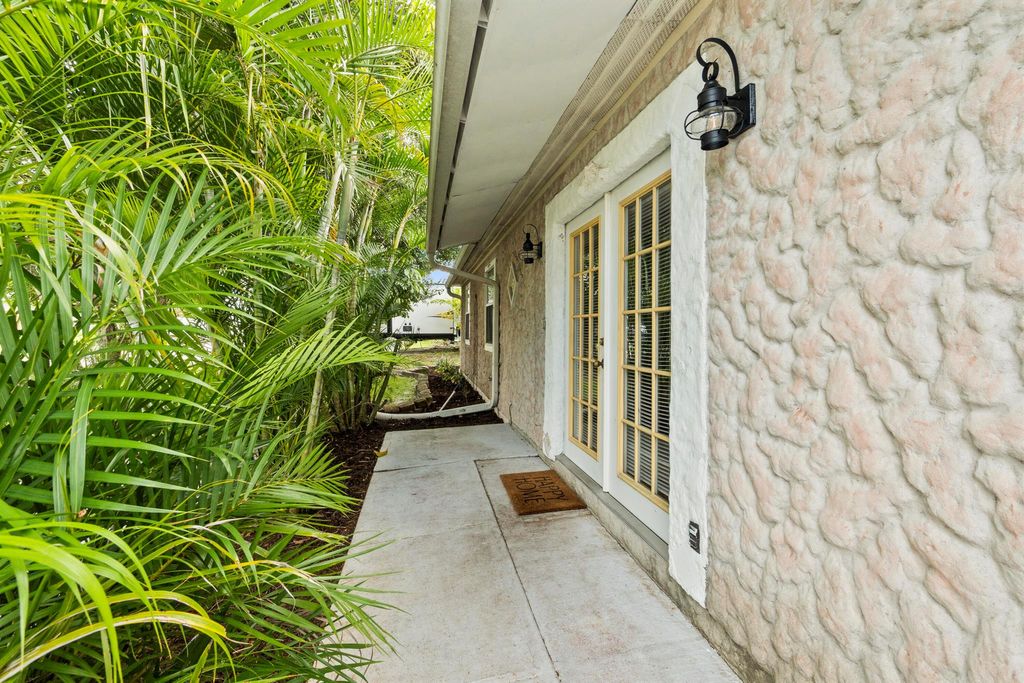 Photo of 1720 NE 23rd Terrace, Jensen Beach, FL 34957 (MLS # R10930213)