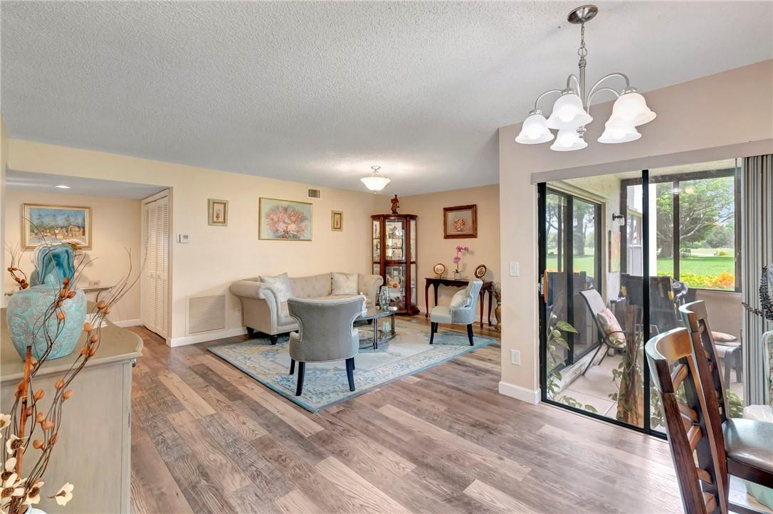 Rare First-Floor Corner Unit in The Coves of Aberdeen East! This spacious 2-bed, 2-bath condo with a large den (easily converted to a 3rd bedroom) is the largest floor plan in the community. Bright and airy with golf course views, it features newer 10 mm laminate flooring, an updated kitchen with custom cabinetry, granite countertops, stainless appliances, and beautifully remodeled bathrooms. The primary bedroom windows have been upgraded to impact glass. Enjoy the enclosed patio and pristine interior. NO MANDATORY MEMBERSHIP FEES—HOA includes full access to clubhouse amenities. Aberdeen East offers a vibrant 55+ lifestyle in a prime Boynton Beach location near shopping and dining. Don’t miss this one!