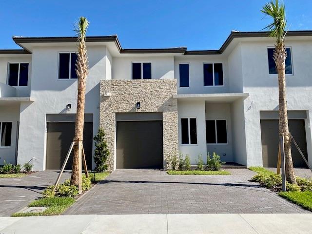 Welcome to this beautifully maintained 3-bedroom, 2.5-bathroom townhouse perfectly situated in the heart of Wellington/Royal Palm Beach. Featuring soaring high ceilings and an open, airy layout, this home offers both comfort and style. Enjoy the convenience of an in-unit washer and dryer, as well as the peace of mind that comes with hurricane-impact windows and doors. The private backyard is perfect for relaxing, entertaining, or enjoying Florida's. Ideally located near world-class equestrian venues, premier shopping and dining, major highways, and top-rate school. Don't miss your chance to live in one of South Florida's most sought-after communities! Renter pays for all utilities. Deposit, First and last month move in. No smoking allowed. Up to 25lbs small pets permitted.