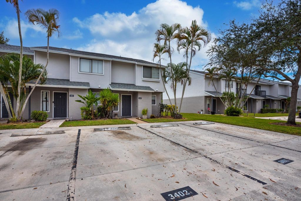 Photo of 3401 Poolside Drive, Greenacres, FL 33463 (MLS # R10937080)