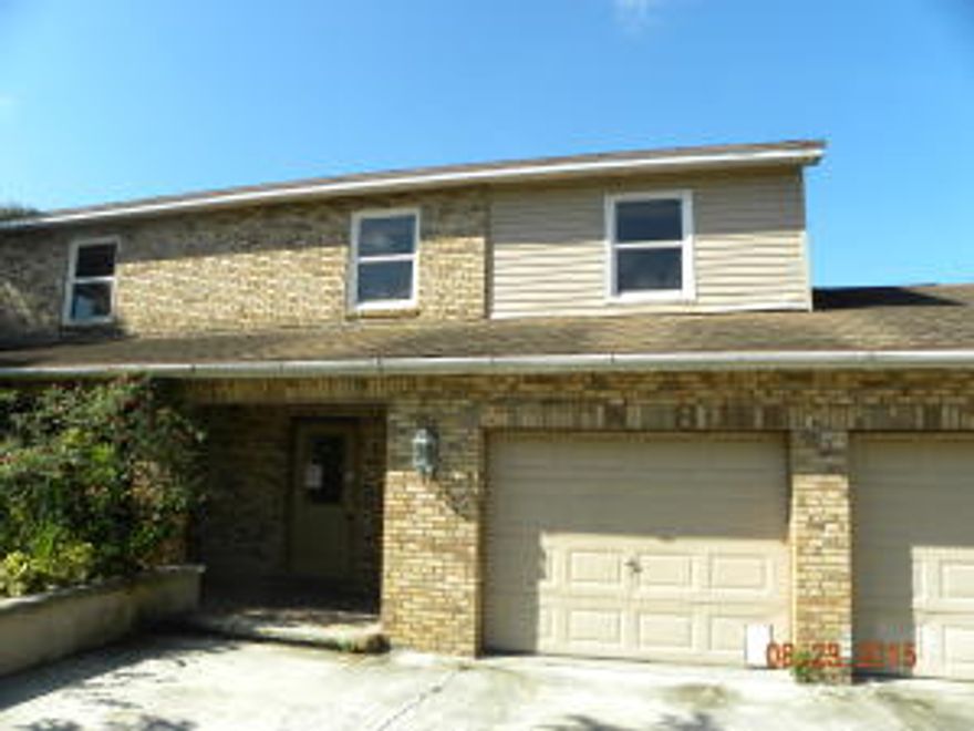 Stop and take a look at this 4 side brick home.  All bedrooms on second floor, attached 2 car garage, corner lot, wide driveway, tile floors downstairs.  Large screened patio.  Real county living.Employees and family members residing with employees of JPMorgan Chase Bank, N.A, its affiliates or subsidiaries are strictly prohibited from directly or indirectly purchasing any property owned by JPMorgan Chase Bank, N.A.