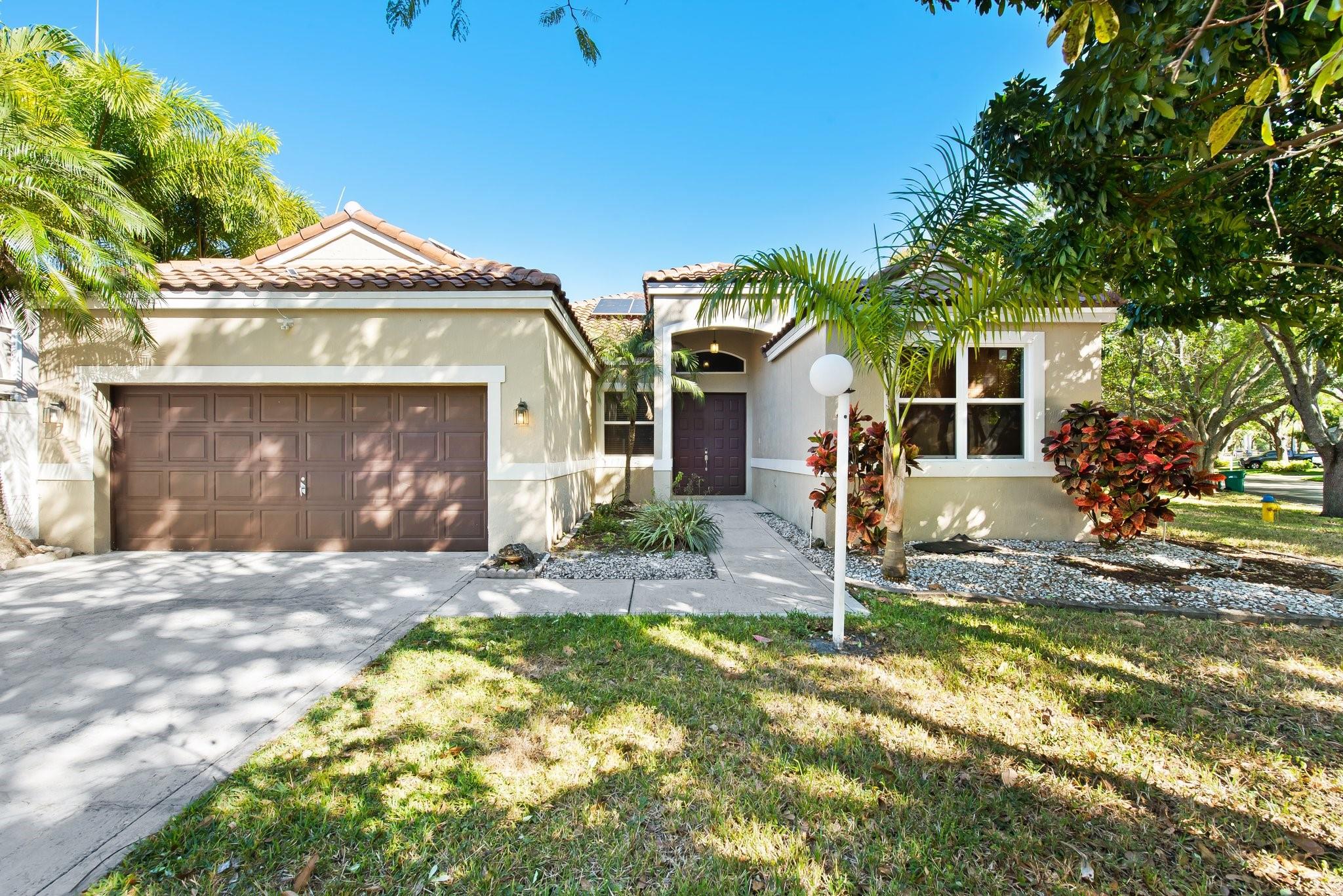 Seller Credit $10,k, Low HOA of $180/month. Located in the gated community of Mayfair at Parkland, this renovated 4-bed, 2.5-bath home boasts 2,618 sq. ft. of living space, on one of the largest lots in the neighborhood with a hot tub already present, and room for a pool. Features include a fully paid solar system, new roof, new AC with warranty and new impact windows, offering energy savings and minimal electric bills. The open-concept layout connects the granite & stainless steel kitchen to the dining and living areas. The primary suite features a custom walk-in closet and a luxurious en-suite bath. Community pool, and steps from Terramar Park. Top-rated schools: Riverglades (10/10), Westglades (9/10), and Stoneman Douglas (8/10). Don't miss this opportunity.