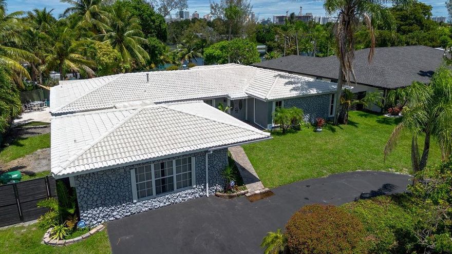 Located on a hill format from all sides. all windows have Hurricane Shutters. Silicone Hurricane and cemented roof. This house is King of the Hill house with great positioning on the corner of the street providing a wide -open view of the street. very protected in rains and Hurricanes. Sprinkler system using lake water. Touchless flush electronic toilets in 3 bathrooms. Four bathrooms with open space stand-up showers. This house is magnificent space inside with lots and lots of storage closets. 4 fully functioning bathrooms and showers. The interior is spotless clean maintained without pets. This house is a dream to walk around and to enjoy all rooms with windows to let light enter the whole house making each day special.