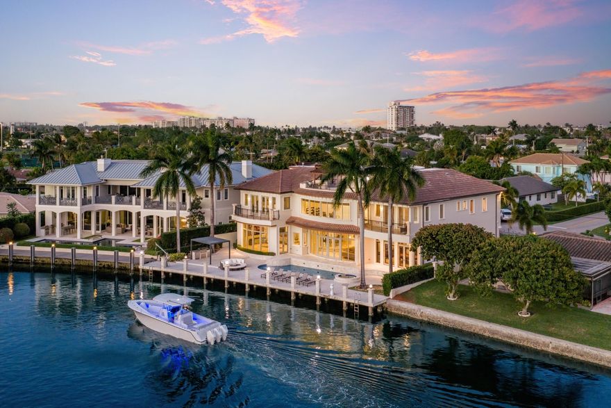 Luxurious Deepwater Gated Estate sited on 103' of frontage with rare wide water views.   Introducing Casa Del Toro, an extraordinary three-story Modern Mediterranean estate set along one of Lighthouse Point's deepest and widest canals, offering over 9,500 square feet of refined waterfront living and 103 feet of equipped deepwater dockage with direct ocean access. Behind gated entry, a dramatic rotunda foyer welcomes with grand floating butterfly staircases, marble floors, intricate ceiling detailing, and an original Murano chandelier imported from Italy. Sweeping water views carry throughout the formal living spaces, raised dining rotunda, expansive chef's kitchen, and sophisticated club room with private bar, creating a home designed equally for elegant entertaining and everyday luxury. The 2,000+ square foot primary suite wing is a true private retreat with a study, dual spa-inspired baths, sauna, oversized dressing rooms, and a waterfront balcony. Additional highlights include a 12-seat immersive theater, elevator, whole-house generator, advanced smart home technology, impact glass, wine storage, and multiple ensuite guest suites. The third level is a standout feature, offering a spectacular sky deck with bar, summer kitchen, full bath, and panoramic sunset views over the water. Outdoors, the resort-style setting offers a saltwater pool and spa, expansive entertaining deck, multiple BBQ areas, fire pit lounge, and generous dockage along the seawall, delivering an unmatched South Florida boating and entertaining lifestyle.    The information published and provided including but not limited to prices, measurements, square footages, lot sizes, features, finishes, and calculations are subject to errors, omissions or changes without notice. All such information should be independently verified. All parties should perform their own due diligence to verify all information.