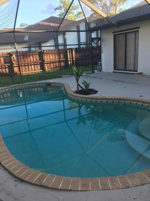 Pool home in the heart of Wellington, conveniently located near equestrian venues, shopping, dining and A+ schools. Completely renovated bathrooms , new roof and skylights newer ac, (2022) new pool pump.Renovated kitchen with granite and new appliances. Huge kitchen island with plenty storage.NO HOA.