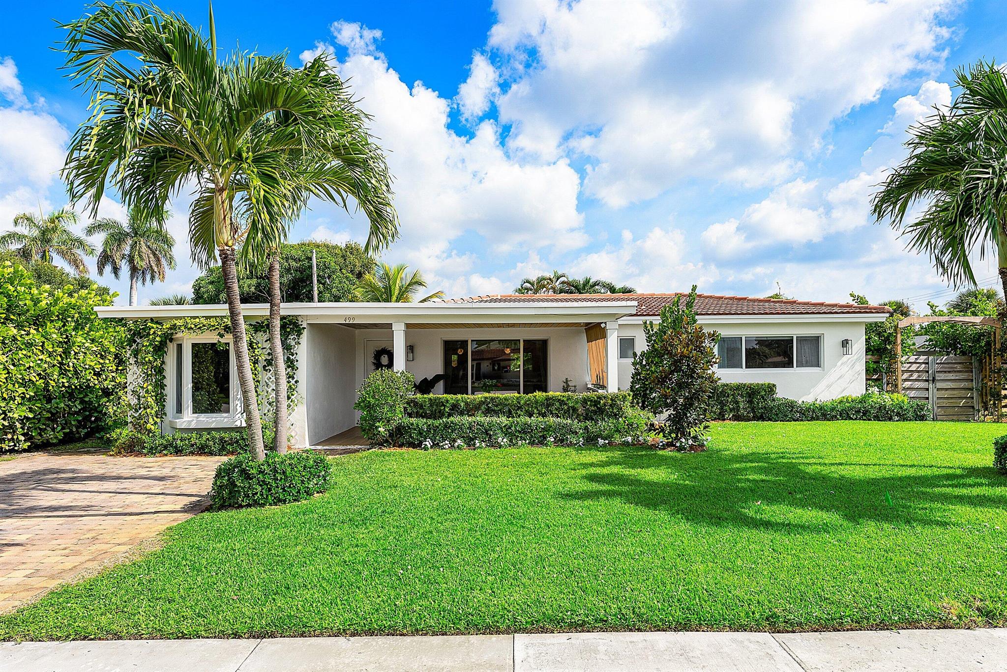 Welcome to 499 NE 28th Road, a coastal gem in East Boca Raton's sought-after Chatham Hills. Just a mile from the beach and local cafes, this elegantly reimagined four-bedroom, two-bath residence offers the perfect blend of style and convenience.Designed for effortless indoor-outdoor living, the home features a summer kitchen, custom fireplace, spa, turfed yard, and an expansive porch ideal for entertaining. Inside, enjoy a brand-new kitchen, bathrooms, flooring, and complete impact glass--all thoughtfully curated with timeless finishes.A rare opportunity to own a fully renovated Boca Raton retreat under one million dollars. Schedule your private showing today.
