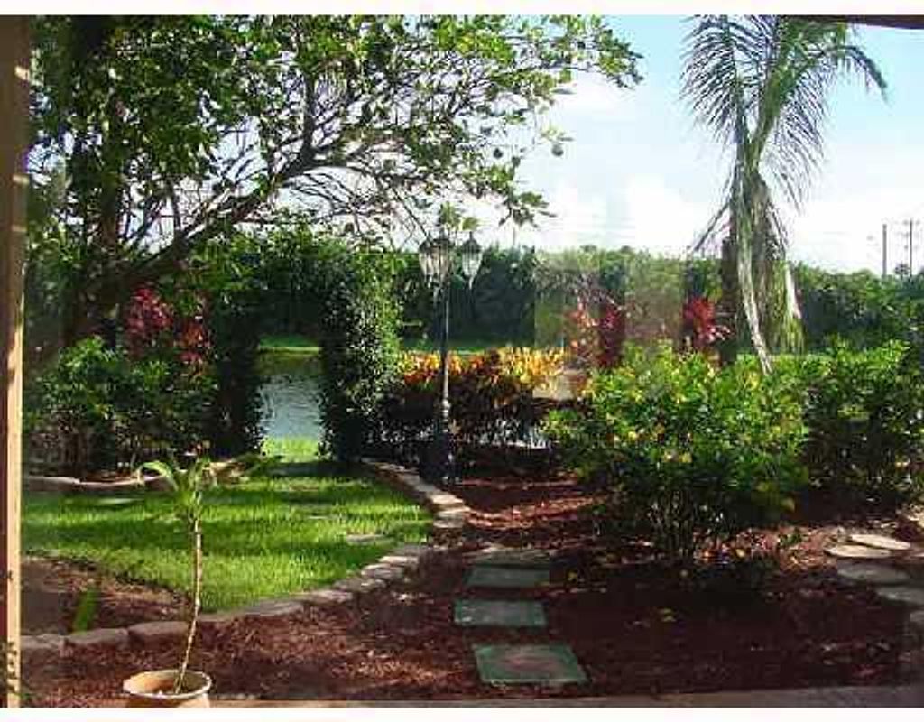Photo of 9067 Long Lake Palm Drive, Boca Raton, FL 33496 (MLS # B26028715)