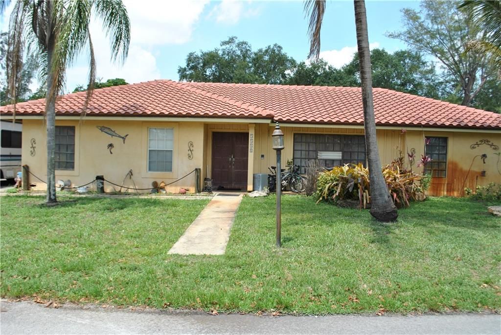 Photo of 55401 NW 76th Pl, Pompano Beach, FL 33073 (MLS # F10283357)