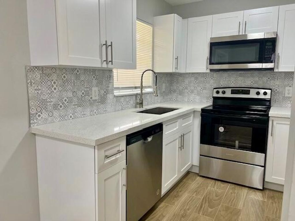 Photo of 430 Coconut Court, South Bay, FL 33493 (MLS # R10998877)