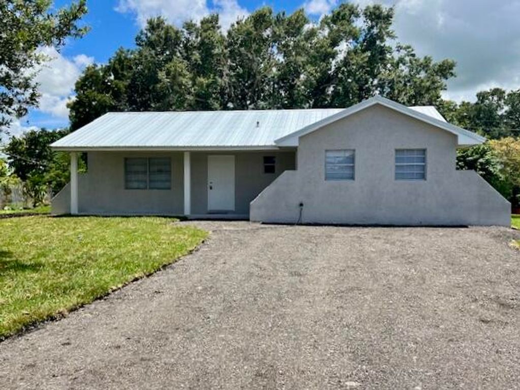 Photo of 430 Coconut Court, South Bay, FL 33493 (MLS # R10998877)