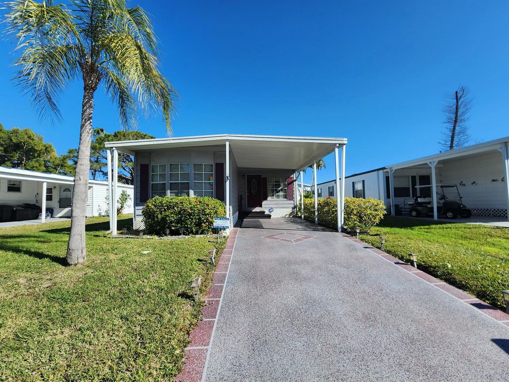 Photo of 16 E Caribbean, Port Saint Lucie, FL 34952 (MLS # R11051905)