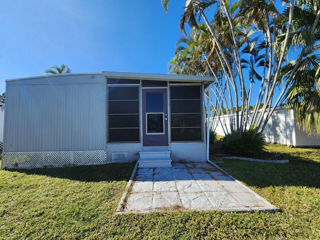 Photo of 16 E Caribbean, Port Saint Lucie, FL 34952 (MLS # R11051905)