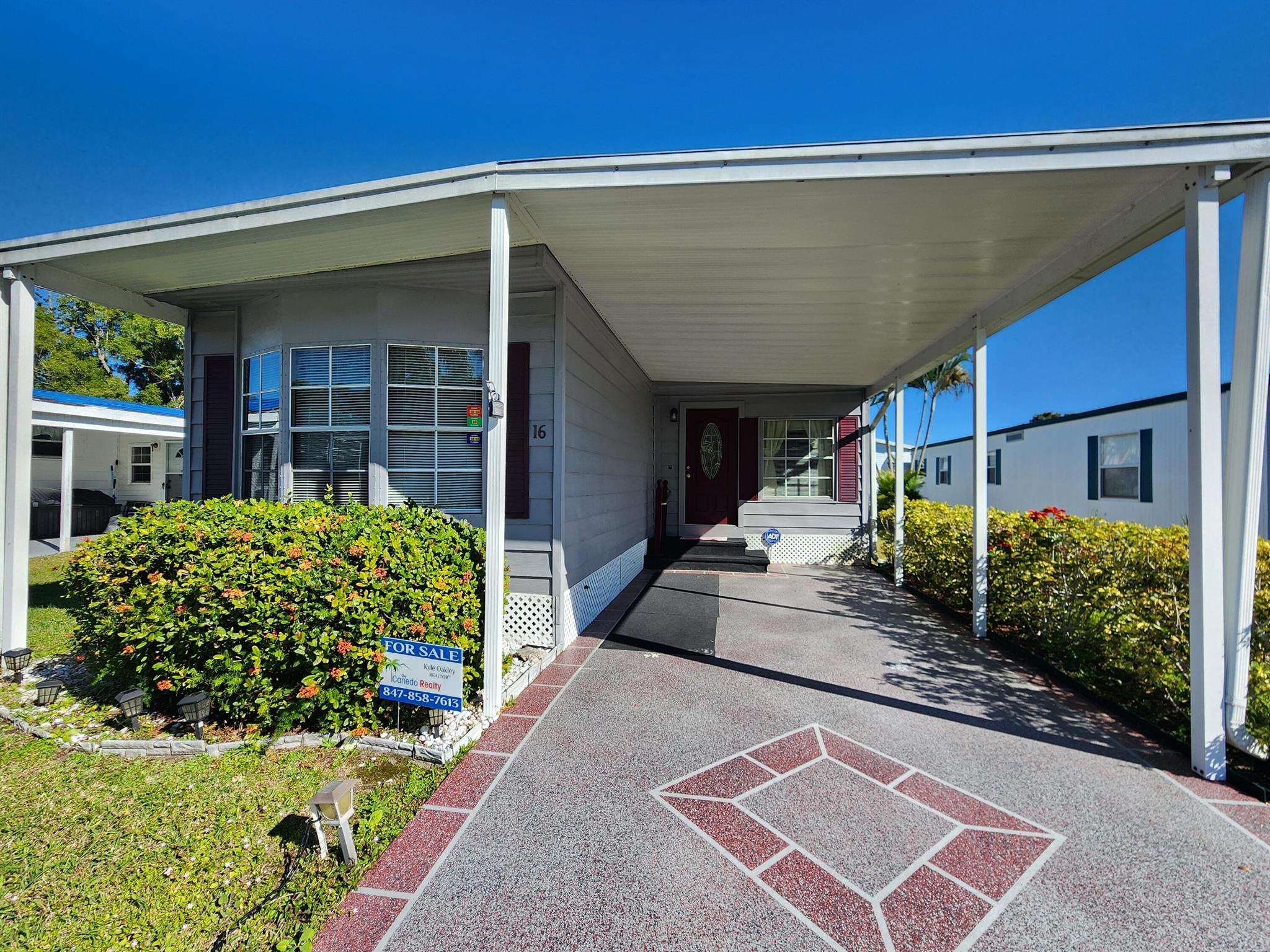SELLER HIGHLY MOTIVATED! Priced to sell, this gem won't last long! Discover your perfect Florida retreat in this beautifully maintained 2-bedroom, 2-bathroom manufactured home! The thoughtfully designed split floor plan offers privacy and convenience, making it ideal for hosting friends and family. The updated kitchen boasts stainless steel appliances and plenty of counter space to prepare meals and entertain. Relax in the spacious living area or step outside onto your stone patio, where you can soak up the Florida sun and enjoy the serene surroundings. This home offers peace of mind with a newer A/C, as well as the hot water heater being updated in 2020. Located in a friendly community, this property is perfect for seasonal or year-round living. (Lot Lease of 865.27/month)