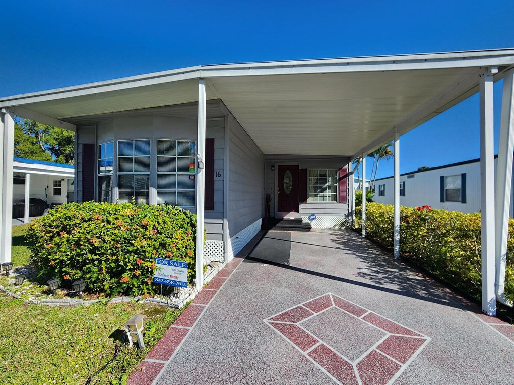 Photo of 16 E Caribbean, Port Saint Lucie, FL 34952 (MLS # R11051905)