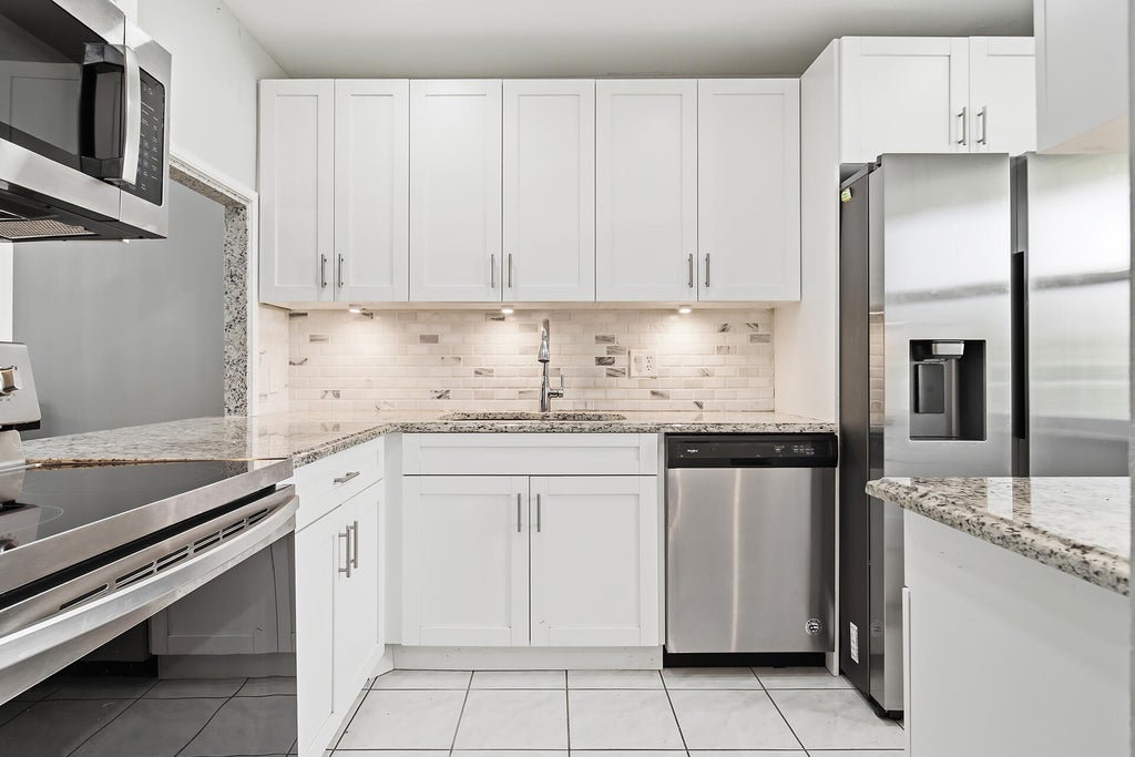 Photo of 232 Lake Meryl Drive, West Palm Beach, FL 33411 (MLS # B26055554)