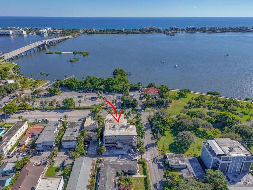 This is a rare opportunity to own in a one-of-a-kind boutique luxury condominium in Lake Worth Beach that is pet friendly and located just steps from the Intracoastal Waterway, vibrant town center, and oceanfront. This immaculate and fully renovated 2,230-sq.-ft. unit offers 3 bedrooms, 3.5 baths, a guest powder bath, formal dining room, dedicated laundry room, office, plus a 314-square-foot wrap-around balcony with views of the pool and Intracoastal - the perfect place to enjoy your morning coffee.   Highlights include complete impact windows and doors and travertine marble flooring throughout.  The open floor plan features a 28' x 18' living room, and a beautifully updated kitchen appointed with warm wood cabinetry, marble backsplash, stainless steel appliances, quartz countertops and a breakfast bar.  Each bedroom has its own en-suite bath. There is a guest powder room.  The unit features a 12 x 8 in-home office (or hobby room), a dedicated laundry room, and a formal dining room.  This unit has abundant storage inside, plus you have an exterior storage closet. The condo allows up to 2 pets. Exceptional location just steps from the historic Gulfstream Hotel that will be completely renovated in a couple of months, and you will be able to enjoy walking to the seafood restaurant, rooftop bar and other hotel amenities from your new home.   You will love the European lifestyle Lake Worth Beach offers its residents.  This city by the seas has one of the highest walkability ratings in the nation.  Hip and artsy downtown Lake Worth Beach and its sidewalk cafes, art galleries and specialty shops are right outside your door.  You're never at a loss to find something to do.  Grab your green market bag and head to the waterfront Green Market across the bridge every Saturday.  Play 18 holes at the waterfront public golf course.  Spend the day at the beach where you will find shops, restaurants and a 300' pier where you can fish or just enjoy a leisurely stroll.  Explore the Arts District where local craft brewery Mathews Brewery has live music and special events to enjoy.  Take in a live glass-blowing demonstration at the Benzaiten Center for Arts just around the corner.  Sip on a locally brewed tiramisu latte at the newly opened Carew's Coffeehouse.  The city hosts many outdoor festivals throughout the year with the Street Painting Festival being the city's signature event.  Centrally located to Palm Beach International Airport, Tri Rail, Brightline, downtown West Palm and the glitzy Island of Palm Beach.  Come and enjoy South Florida living!