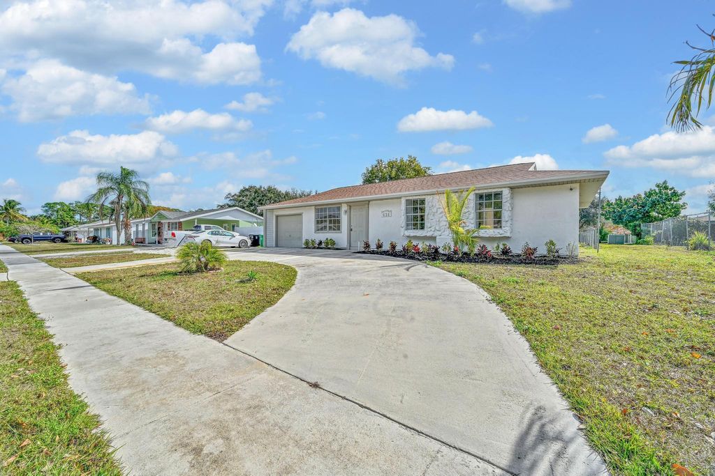 Photo of 434 NE Electra Avenue, Port Saint Lucie, FL 34983 (MLS # R11159881)