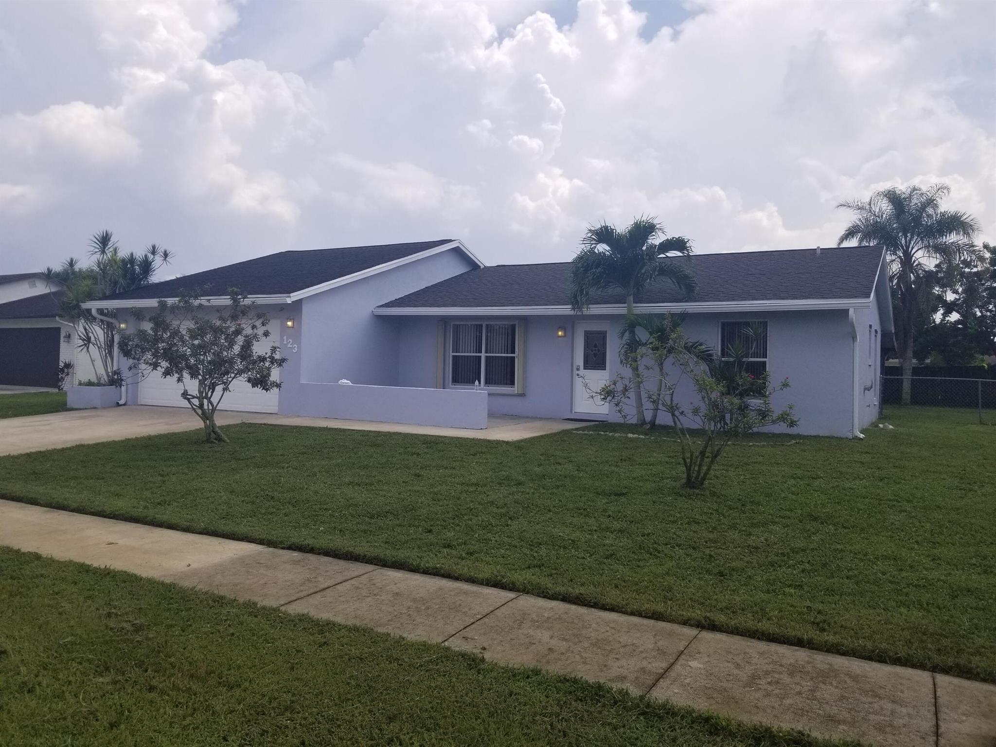 Discover your new home, this newly updated, single-family house nestled in the heart of Royal Palm Beach. This 3-bedroom has just updated Primary bathroom, freshly painted interior, and new flooring. Spacious fenced, backyard in a prime location. Don't miss out on the opportunity to call this charming house your home.