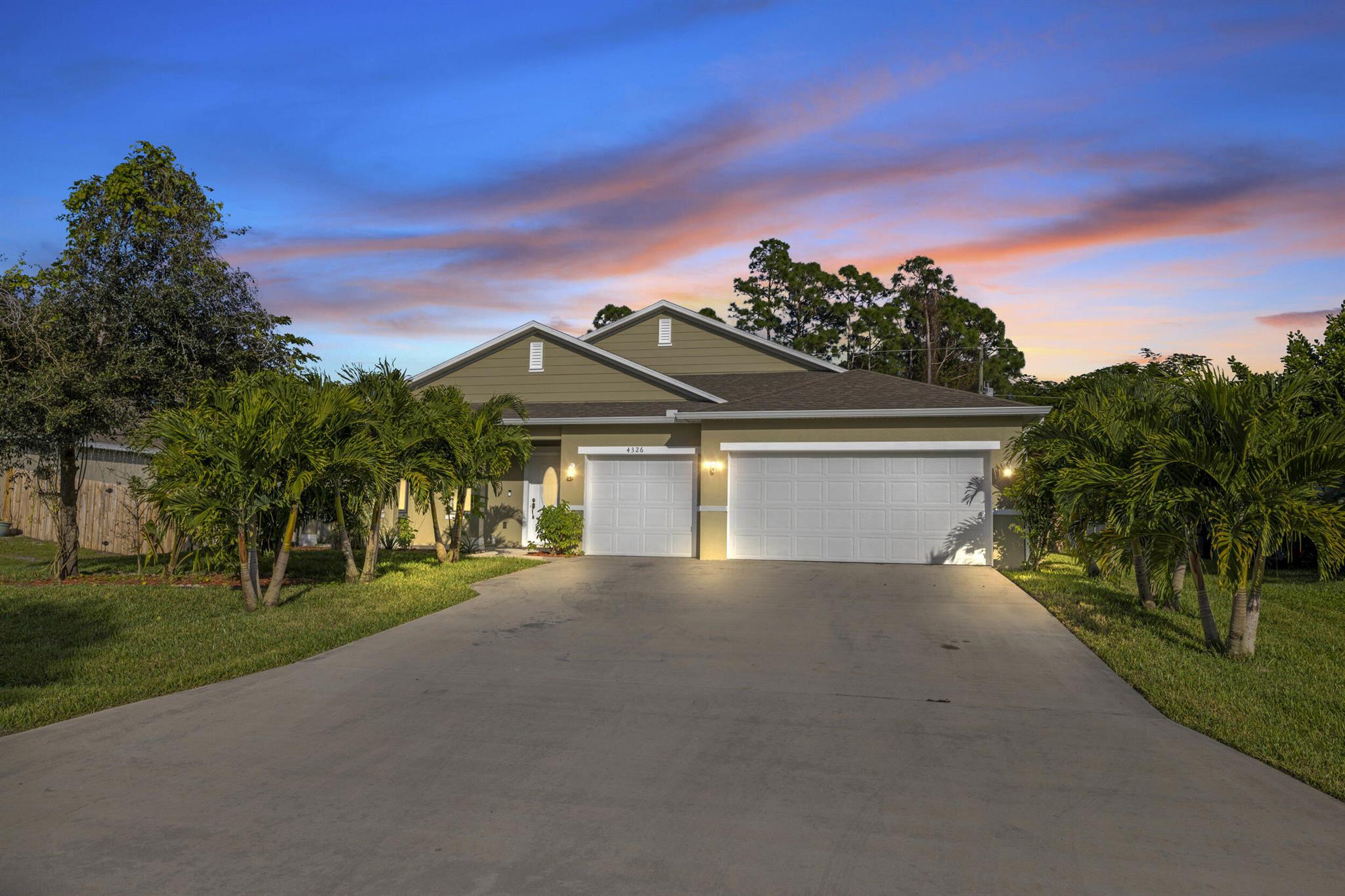 Beautifully Updated 4BR/3BA Home with 3-Car Garage in Port St. Lucie! This 2016-built home features over $30K in upgrades, including new interior/exterior paint, reverse osmosis system, new laminate flooring, and a newly screened oversized patio. Spacious 2,500+ sq. ft. split floor plan with a brand-new kitchen island, ideal for entertaining! Enjoy lush landscaping, mature fruit trees, and a private tropical feel in the backyard. Located near Becker Rd & the Turnpike for easy access.