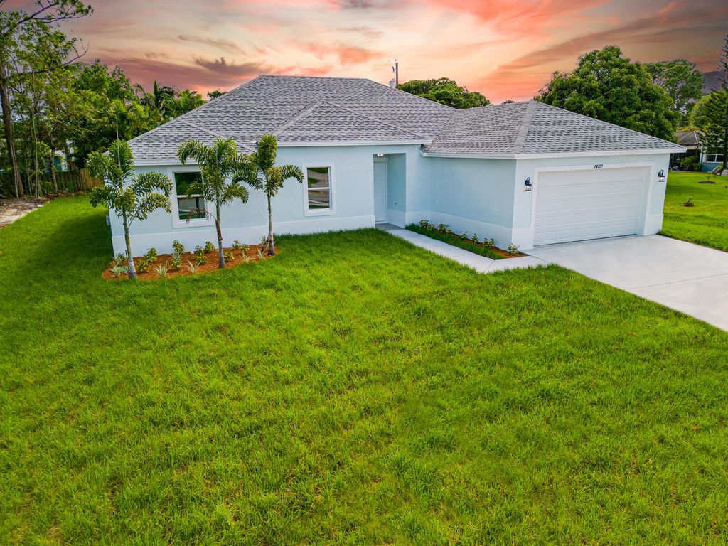 Photo of 1342 SW Calmar Avenue, Port Saint Lucie, FL 34953 (MLS # R10919154)