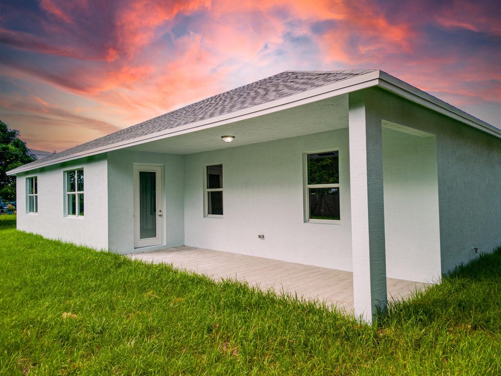 Photo of 1342 SW Calmar Avenue, Port Saint Lucie, FL 34953 (MLS # R10919154)