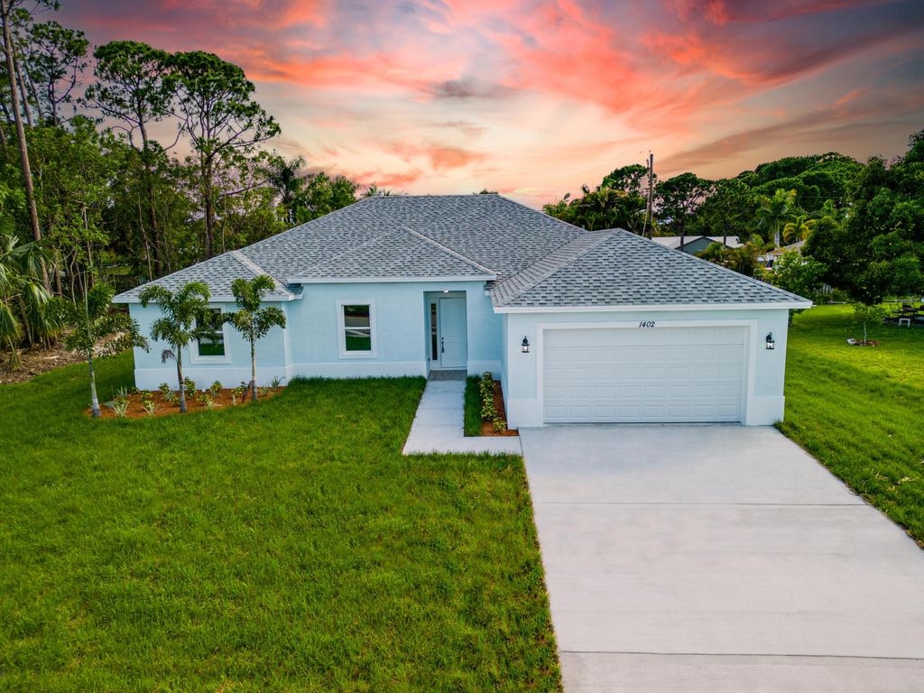 Photo of 1342 SW Calmar Avenue, Port Saint Lucie, FL 34953 (MLS # R10919154)