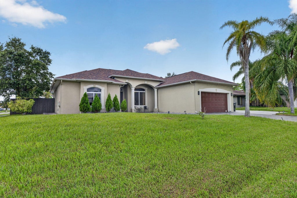 Photo of 1402 SW ABINGDON Avenue, Port Saint Lucie, FL 34953 (MLS # B26076983)
