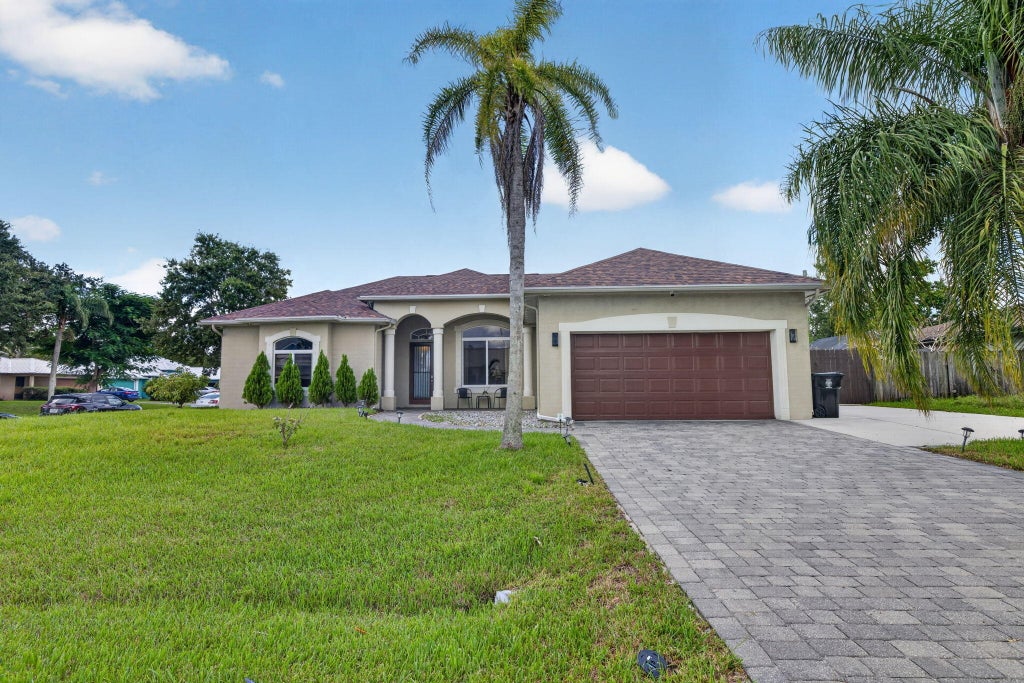 Photo of 1402 SW ABINGDON Avenue, Port Saint Lucie, FL 34953 (MLS # B26076983)