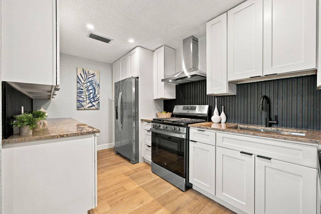 Photo of 2400 NW 85th Avenue, Sunrise, FL 33322 (MLS # B26091111)
