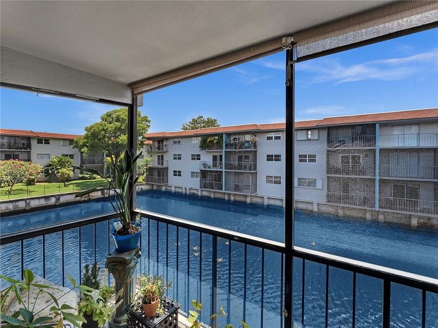 Gorgeous move-in ready 2-bedroom condo in a gated and extremely desirable community in Wilton Manors.  Extremely desirable location with heart of Wilton Dr. just steps away.  Perfectly located minutes from Las Olas, the beach and the airport.  Sweeping canal and water views from your screened-in balcony provides tranquility and peaceful vibes. The unit has been renovated and refreshed for new owners.  In-unit washer/dryer; hurricane proof windows throughout; brand new electrical panel (May 2022); large living spaces; assigned parking space plus plenty of guest parking; ready to go at an outstanding price.  This won't last long.  Complex is private and gated with a large workout room/gym; large pool and picnic/bbq areas. Live in the heart of Wilton just a short walk from the Drive.