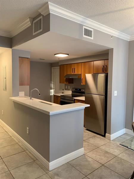 Photo of 6020 W SAMPLE Road #105, Coral Springs, FL 33067 (MLS # B26065651)