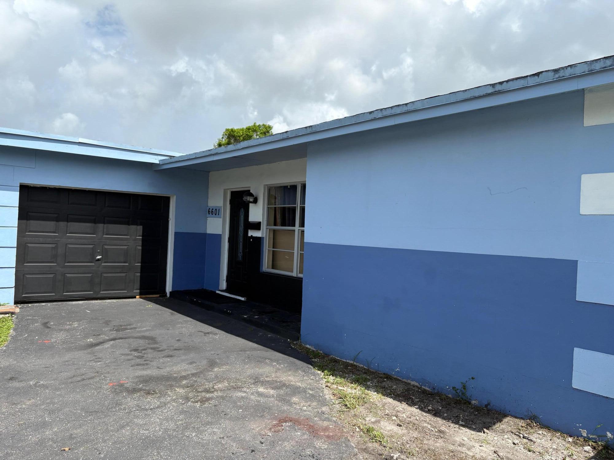 Embrace freedom--no community restrictions (NO HOA!!), just the sunshine state lifestyle calling your name in this charming 2-bed, 2-bath single-family home in Sunrise Golf Village. Features laminate floors, abundant natural light, spacious living areas, and a 2012 roof. Enjoy a bright kitchen, 1-car garage that has been converted to a bedroom and laundry area.Can be easily converted back. 6,000 sq ft lot with mature fruit trees. Great layout with central A/C, updated appliances, and peaceful neighborhood vibe. Ideal for first-time buyers, downsizers, or investors. A real South Florida gem, waiting for your personal touch to transform into a beautiful home. Don't miss this one!!