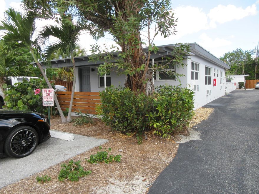 Two bedroom, one bath apartment in a very well maintained building with private front patio, plenty of parking and common area laundry. Unit has brand new floors, granite countertops with stainless steel appliances, impact windows and fresh paint. DON'T MISS THIS GREAT OPPORTUNITY!!!! No HOA so approval is fast to move in right away. Owner is in the process of doing new asphalt to parking lot and artificial turf for green area out front.