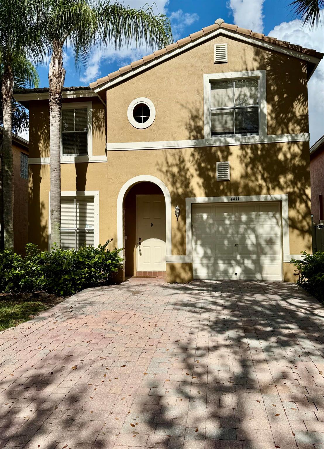 Nestled in the highly desirable Lakes of Laguna gated community in West Palm Beach, this freshly painted (inside and out!) 3-bedroom, 2.5-bath home offers a serene lakefront setting and a layout designed for both comfort and entertaining.Step inside to a bright and spacious living area, low-maintenance tile flooring on the first floor, and a well-appointed kitchen with new range. Sliding doors lead to a wide, open backyard--ideal for relaxing or gathering with friends and family.Upstairs there are two bedrooms plus the primary suite which boasts a generous walk-in closet and private en suite bath. Laminate flooring throughout the second floor. Additional highlights include a new A/C system, two year old hot water heater, new Dryer and a 1-car garage.