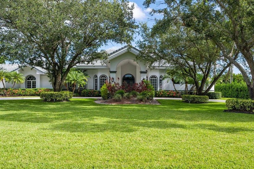 This gated equestrian property sits on 4.62 ACRES and is absolutely stunning!! The 4 bedroom, 4-1/2 bath home is extremely spacious with over 6,000 square feet under air! Featuring a split bedroom plan, large kitchen, office with a fireplace, formal dining room and a game room with a bar! Each of the bedrooms has a private bathroom and the cabana bath even has a sauna! The screened in heated pool is extremely relaxing and has a large covered patio. The 5-stall center aisle barn has 1 bedroom groom's apt, tack & storage w/washer & dryer and two wash racks. There is also a riding arena, 7 paddocks & large grass field. Don't let this double parcel Paddock Park 2 property pass you by!!