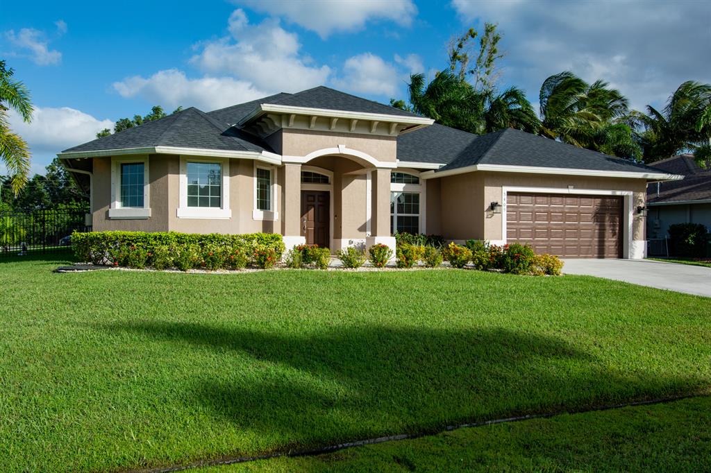 Photo of 5409 NW Cromey Street, Port Saint Lucie, FL 34986 (MLS # R10667627)