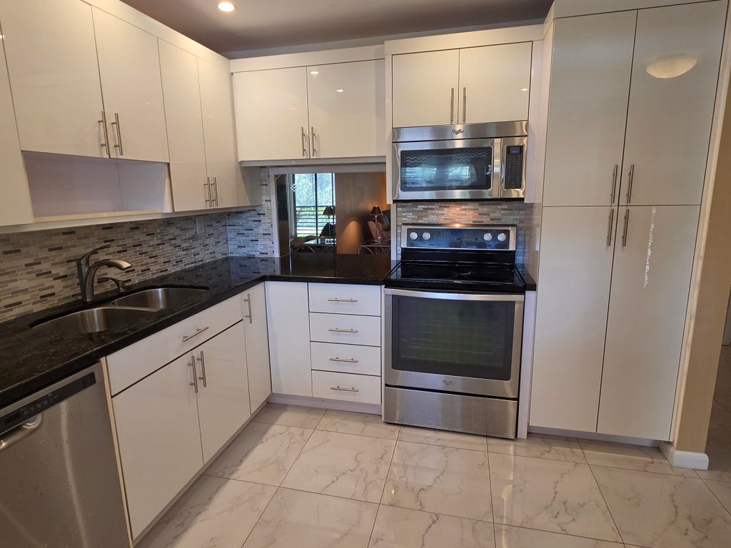Photo of 6090 N Sabal Palm Boulevard #209, Tamarac, FL 33319 (MLS # B26041471)